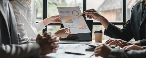 Business people are meeting for analysis data figures to plan business strategies. Business discussing concept.